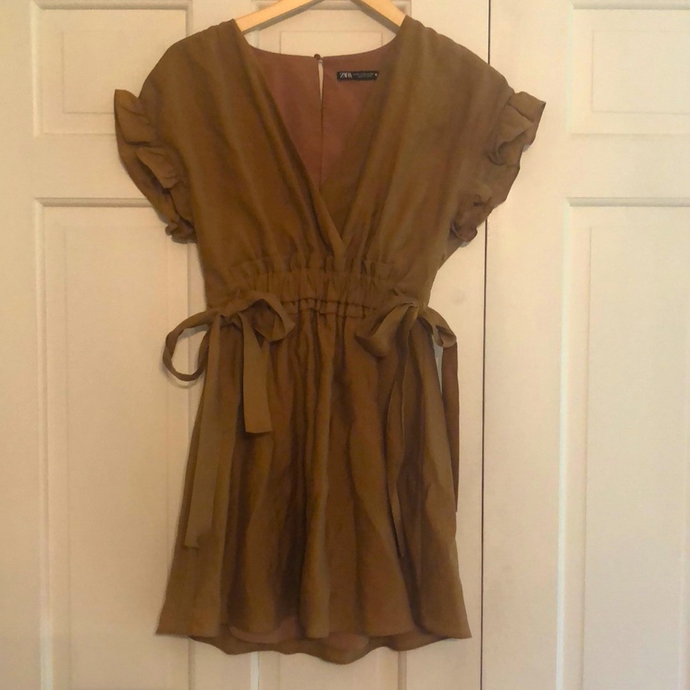 Cotton Linen mini dress with cute ruffle cap sleeve and side bows.